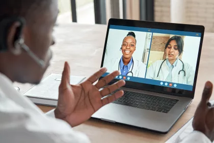 Doctors team conferencing in video call.